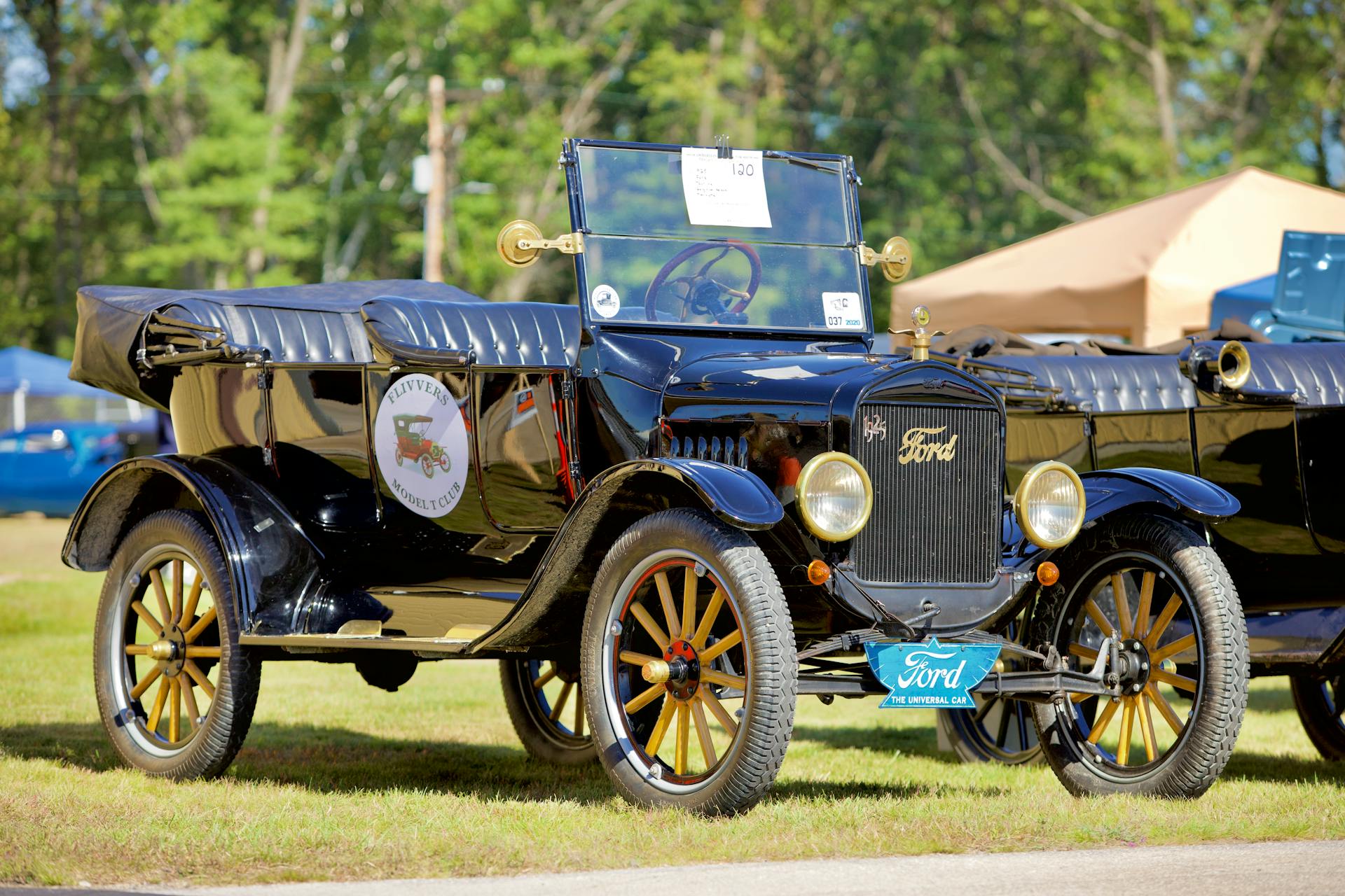 Classic Ford Model T car displayed outdoors, showcasing vintage automotive design.