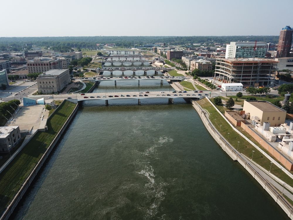 Drone shot of buildings near body of water in Des Moines, Iowa