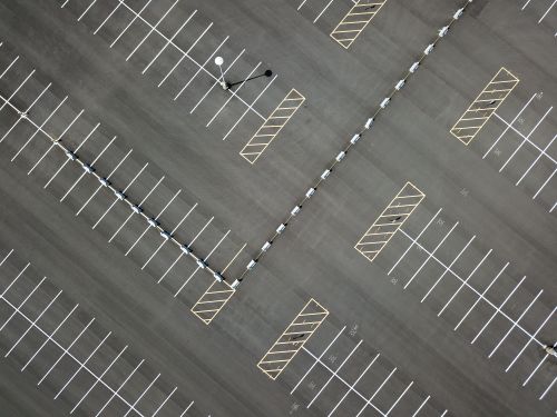 Free An aerial view of a vast, empty parking lot in Maplewood, MN, showcasing patterns and lines. Stock Photo