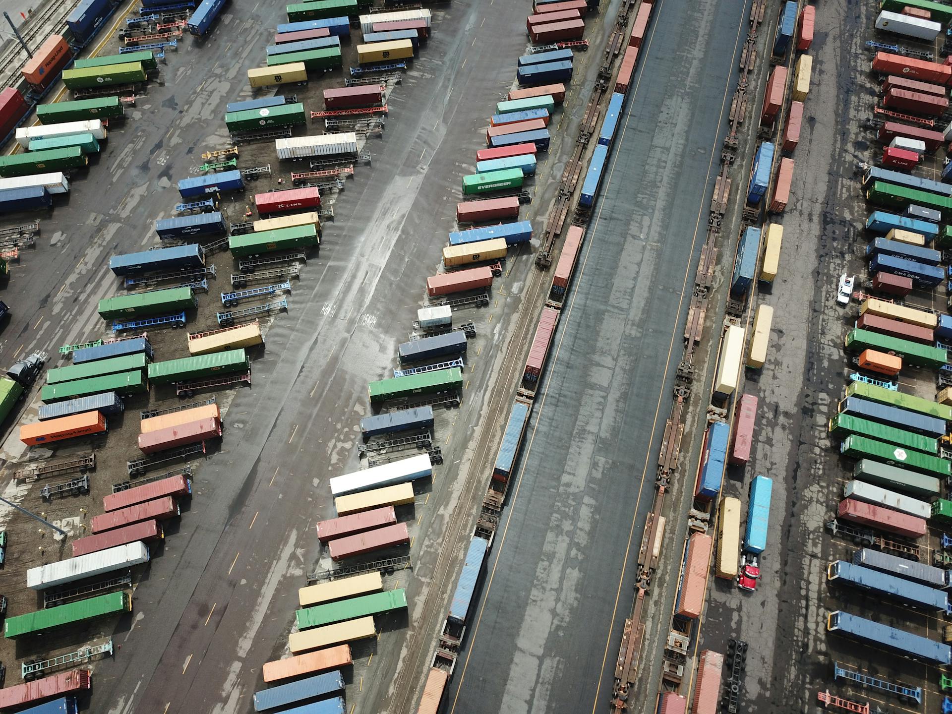Aerial View of a Parking Lot with Cargo Containers