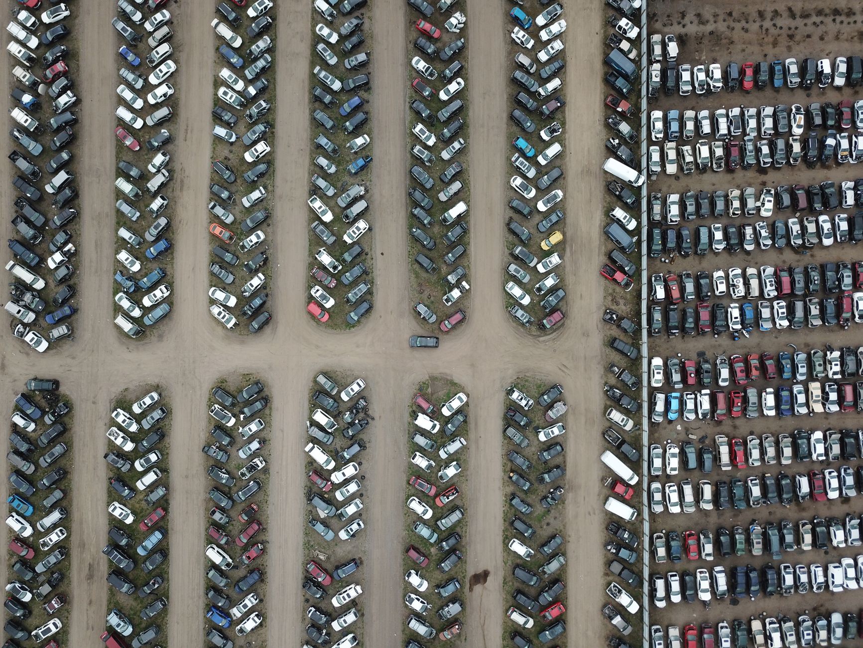 An aerial view of abandoned cars organized in rows at a junkyard in Rosemount, Minnesota.