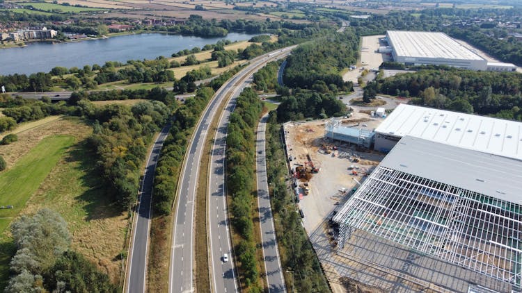 Aerial View Of A Multi-lane Road And Factory Buildings 