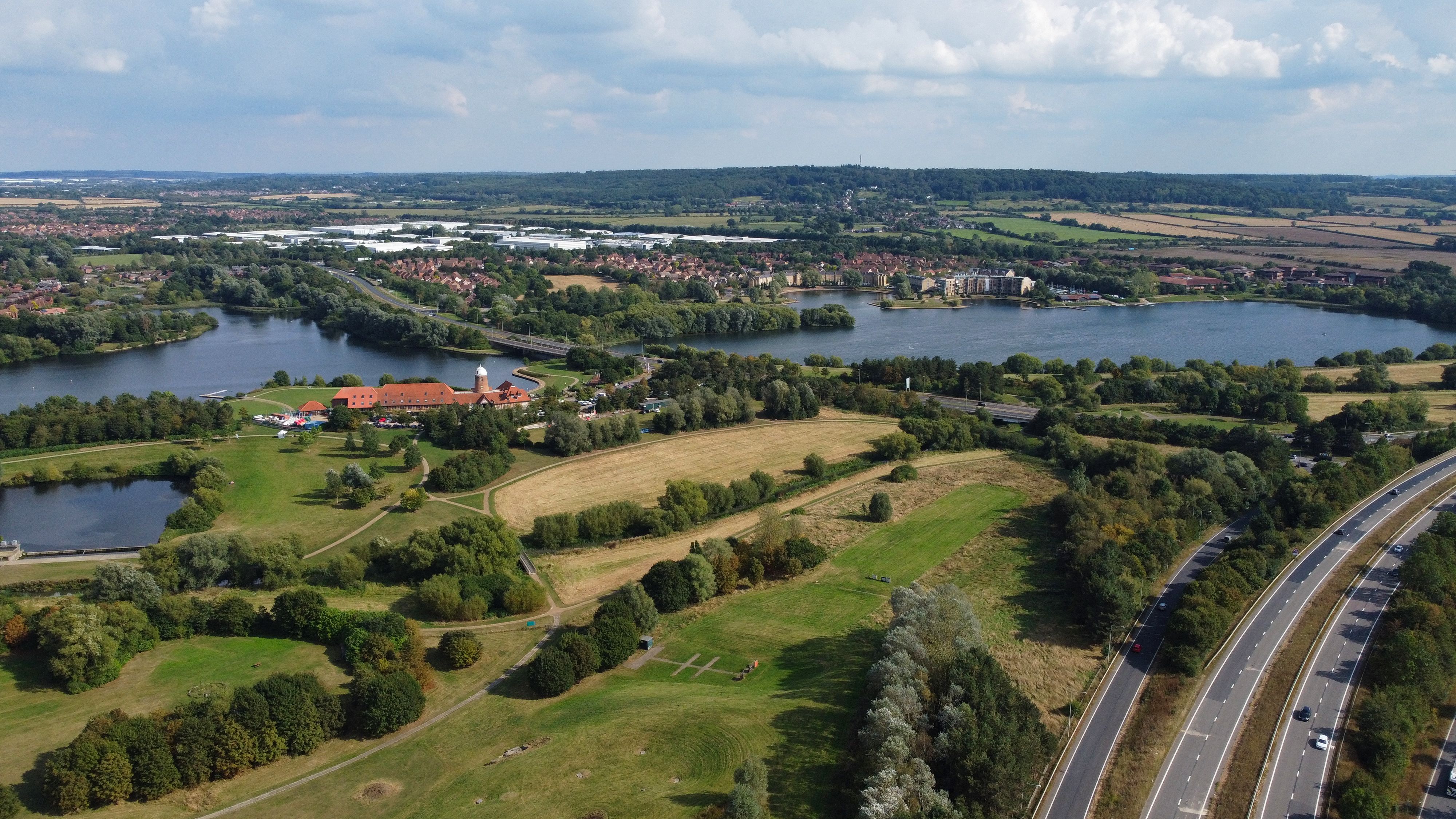 Aerial View of River in between Green Trees · Free Stock Photo