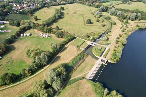 Free Aerial view showcasing the rural landscape and waterways of Milton Keynes, England. Stock Photo