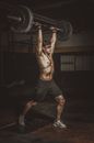 Topless Man Holding Black Barbell