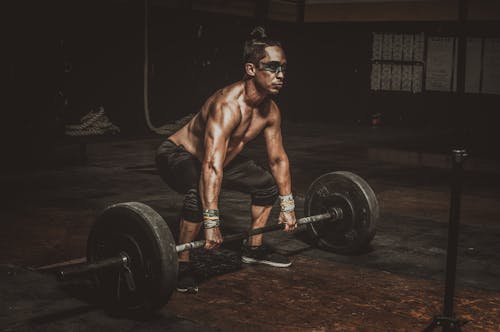 Free Topless Man Holding Black Barbell Stock Photo