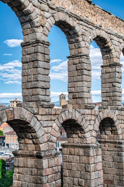 Free Explore the stunning ancient Roman aqueduct arches in Segovia, a classic architectural marvel. Stock Photo