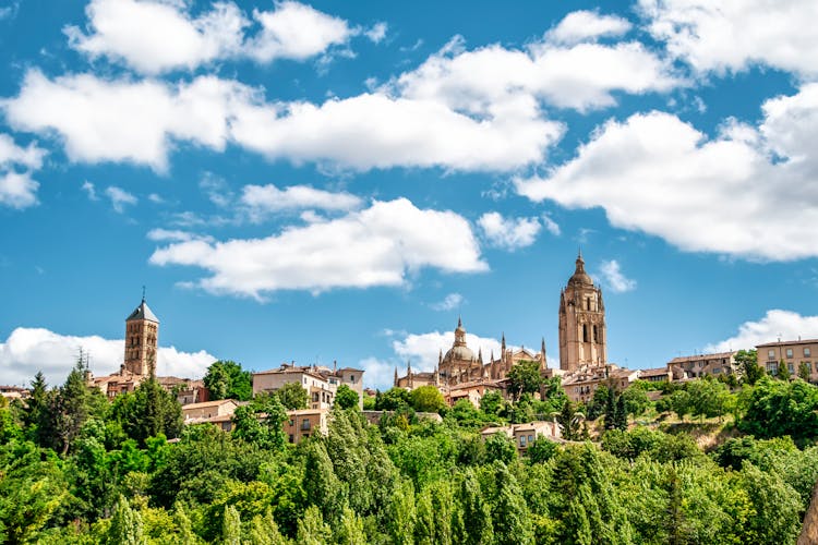 Towers Of Churches Over Trees In Town