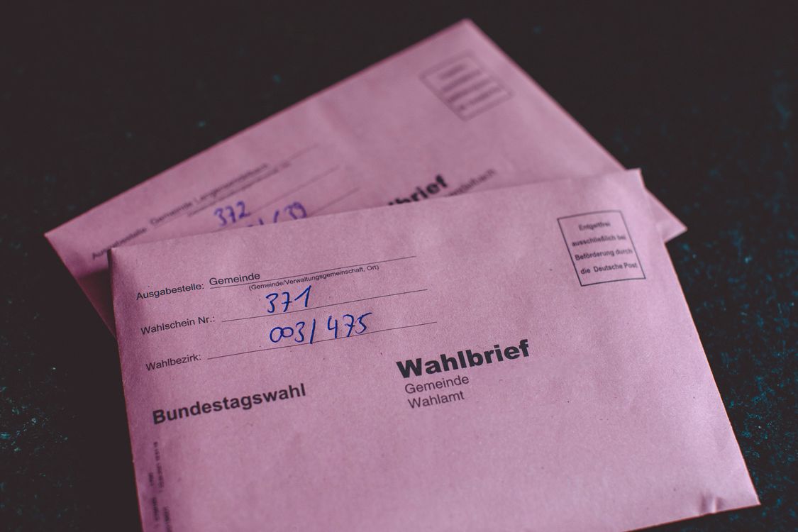 Close-up Shot of Ballot Letters on Black Surface · Free Stock Photo