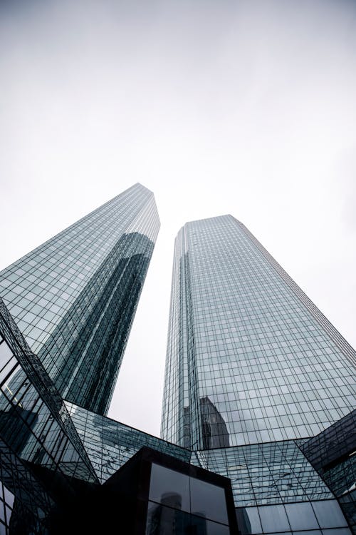 Low Angle Shot of Tall Buildings with Glass Exterior