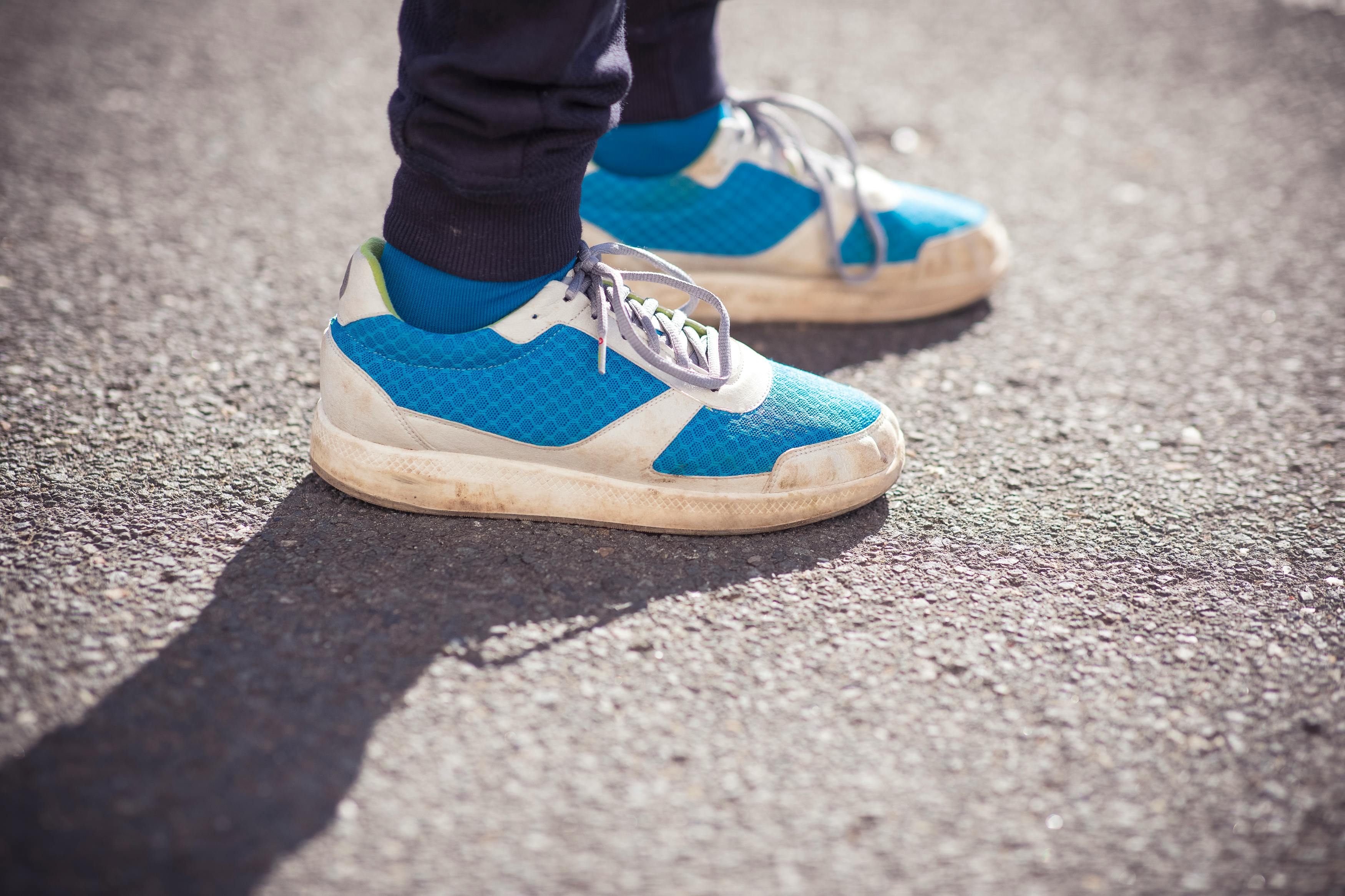 Person Wearing Pair of Black-and-white Adidas Gazelle · Free Stock Photo