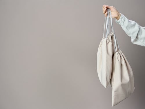 Person Holding White Leather Tote Bag