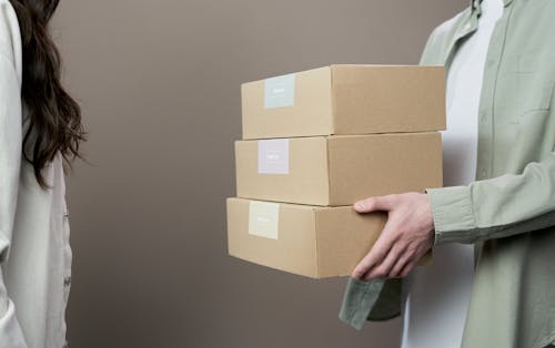 Free Person Holding Brown Cardboard Box Stock Photo