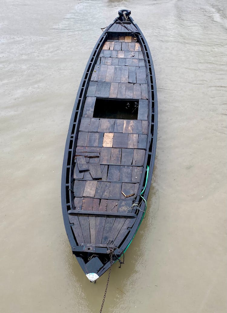 Photo Of A Black Wooden Boat