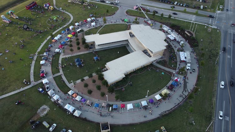 Aerial View Of A White Building Surrounded With Tents In Royce City, Texas, United States