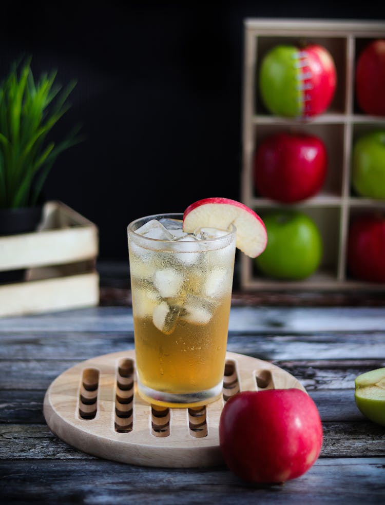 A Glass Of Apple Juice With Ice