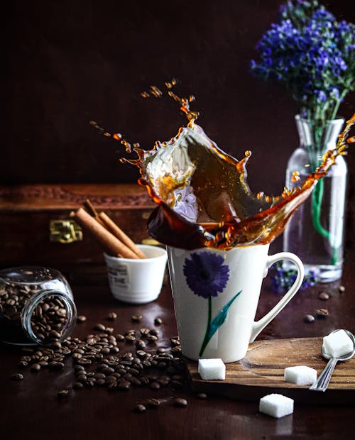 Free Coffee Splashing in Cup on Table Stock Photo