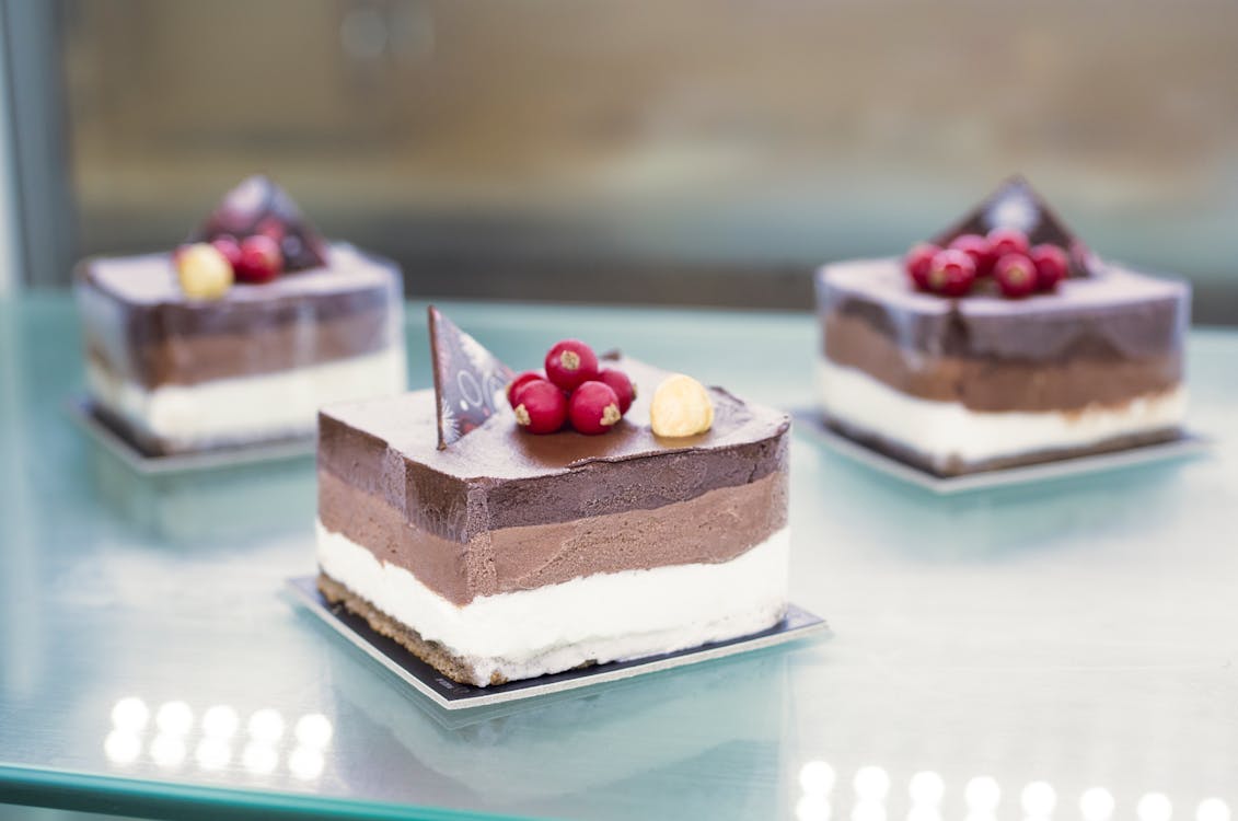 Selective Focus Photo of Sliced Cake on Table