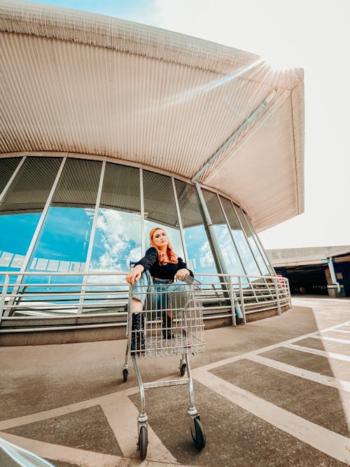 Woman in Black Top Sitting in a Food Cart