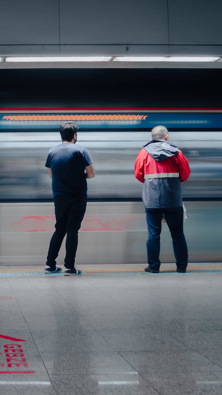 Men Standing On Train Station