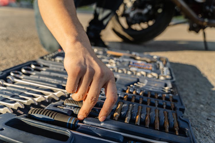 A Man Holding Tools