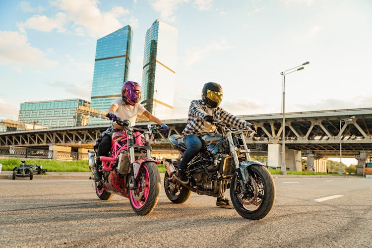 A Man And A Woman On Motorcycles 