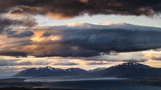 White Clouds over Snow Covered Mountains