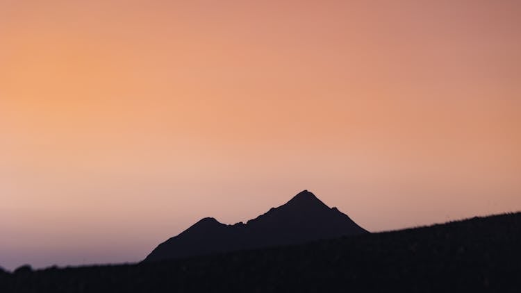 Silhouette Of A Mountain During Sunset