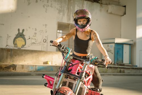 A Woman in White Crop Top Riding Pink Motorbike · Free Stock Photo