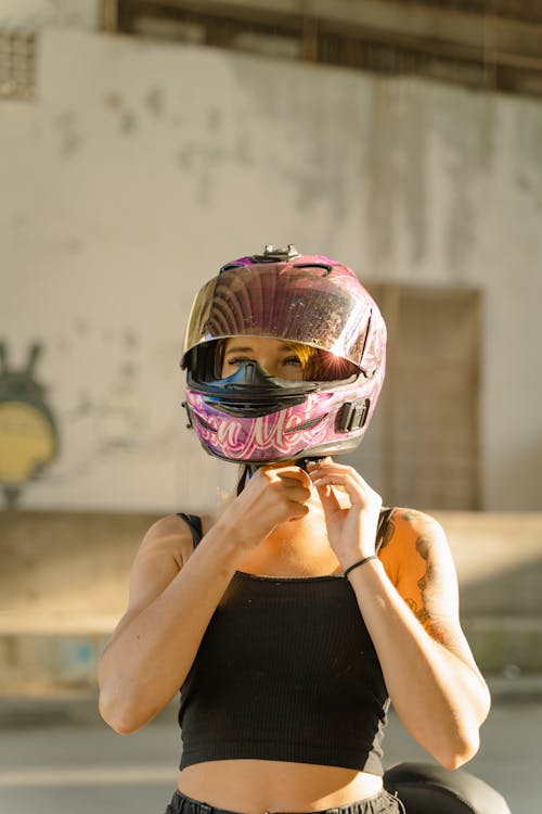 A Woman Wearing a Motorcycle Helmet