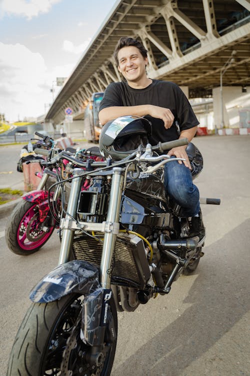 Close-Up Shot of a Man Riding a Motorcycle