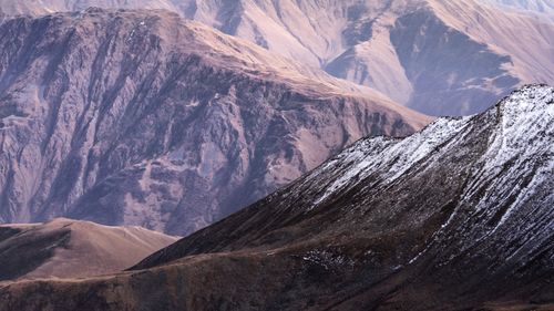 Free Breathtaking view of snow-dusted mountains in Georgia's majestic landscape. Stock Photo