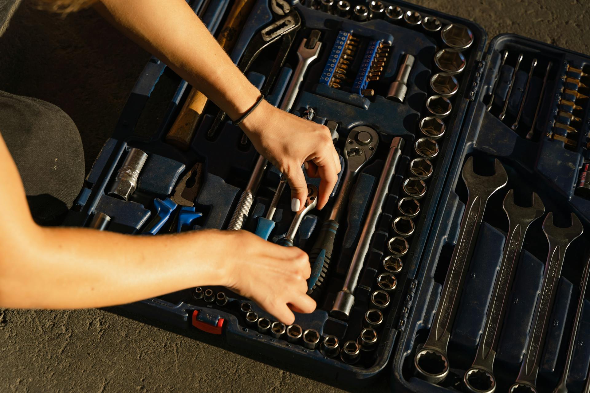 Person Placing a Tool in a Case