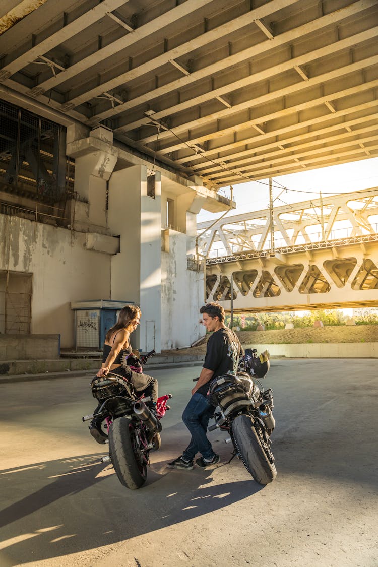 A Man And A Woman On A Motorcycle