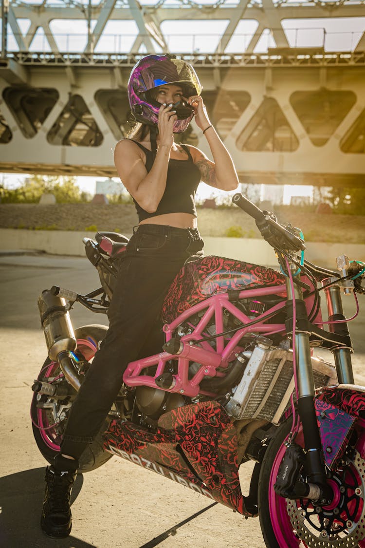 Woman In Black Tank Top Riding A Motorbike