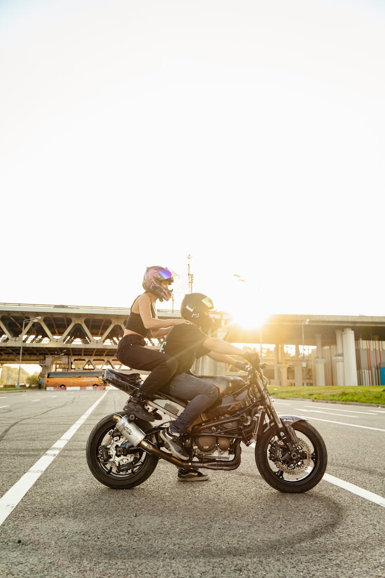 Man And Woman Riding Motorcycle 