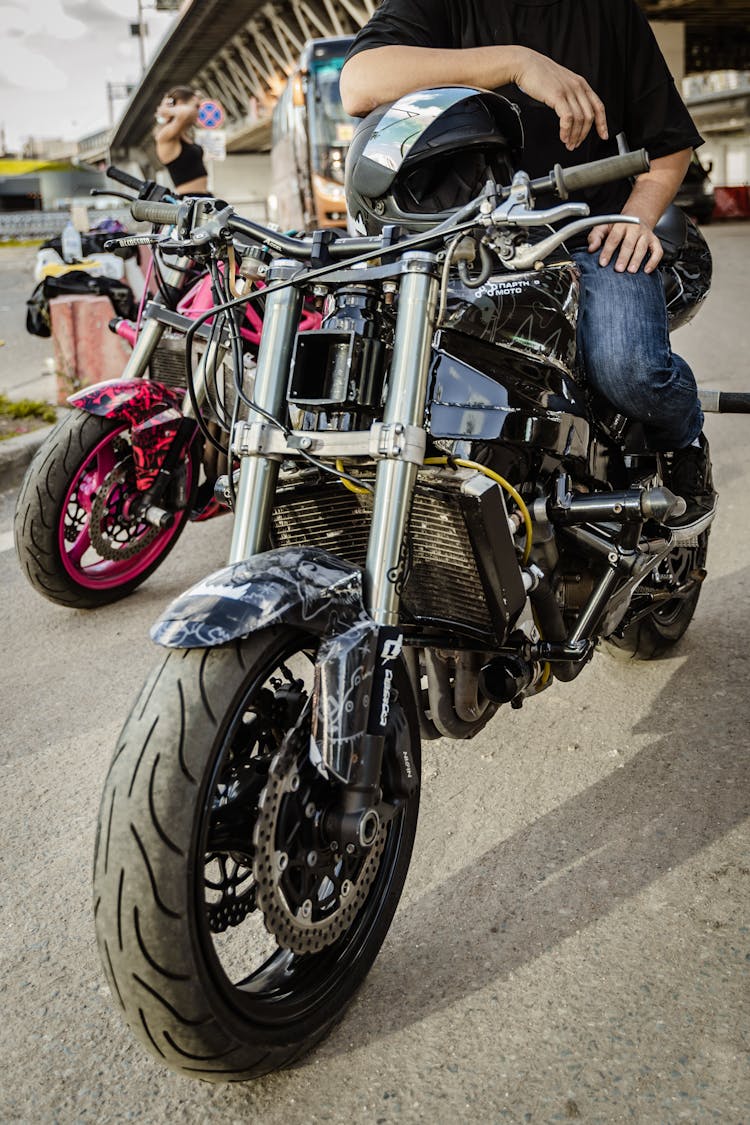 Person Sitting On A Motorcycle