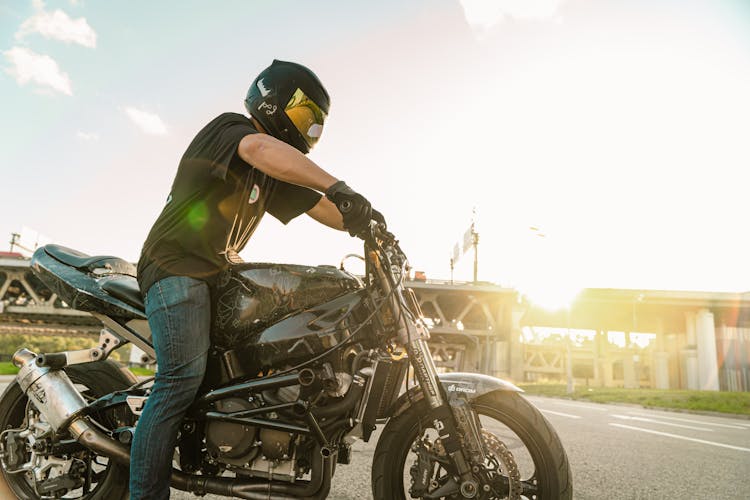 Man In A Motorcycle Helmet And Black Shirt