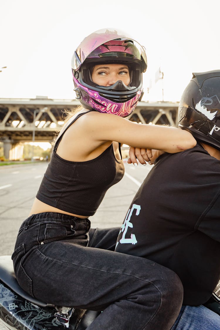 Woman Wearing Helmet Sitting On A Motorcycle