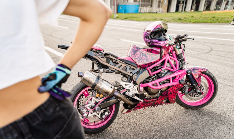 Pink Motorcycle Behind Woman