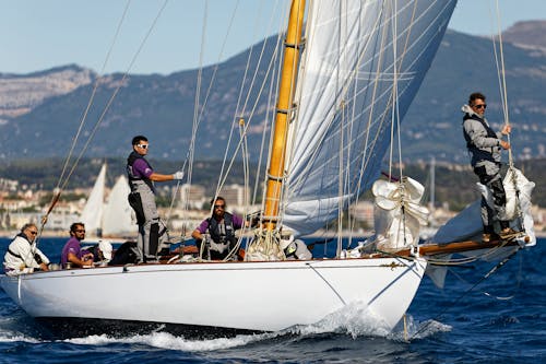 Group of Men Sailing on a Sailboat