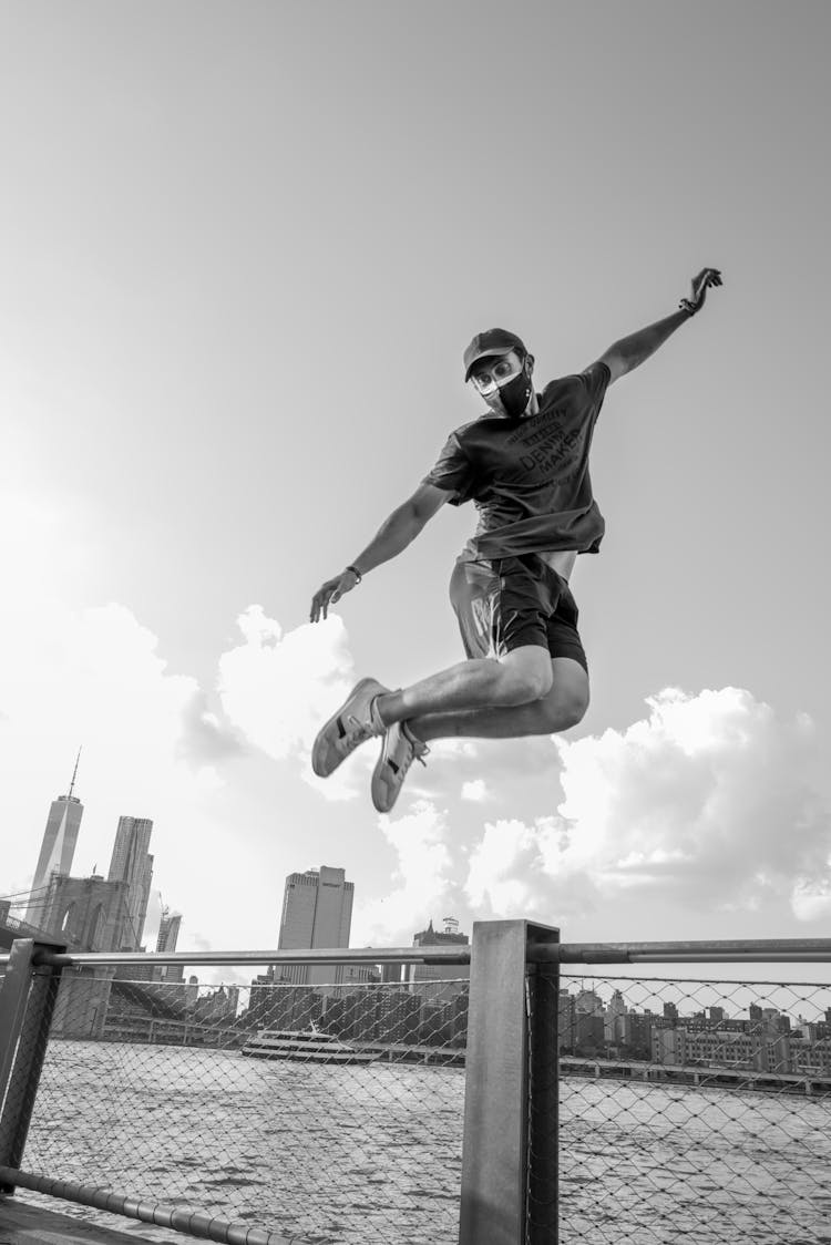 Man Jumping On A Bridge 