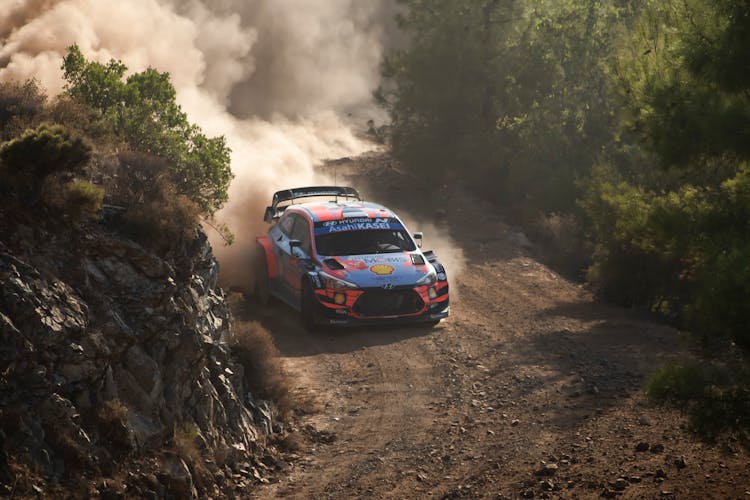 Race Car On A Dusty Road And Smoke