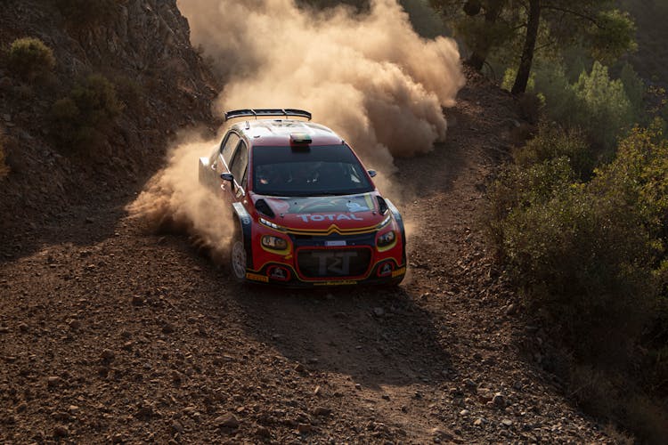 Driving Car Creating Dust Cloud