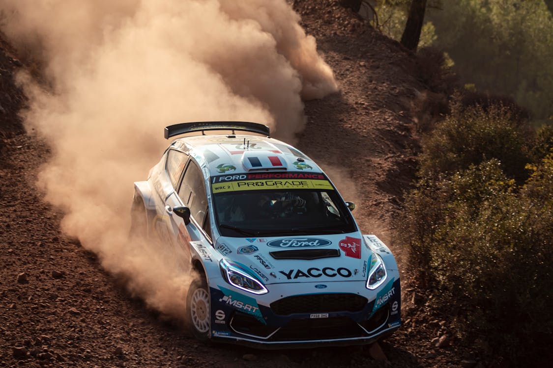 White Rally Car on Dirt Road