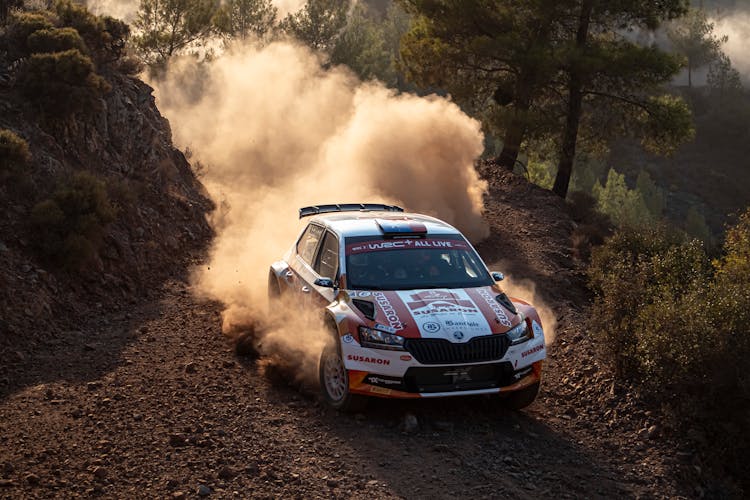 Race Car Driving On Forest Track