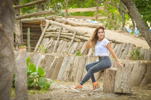 Woman in White Tank Top and Green Leggings Walking · Free Stock Photo