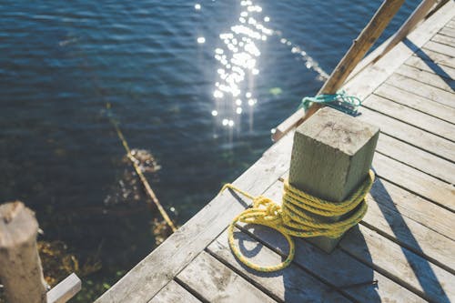 A Yellow Rope on Brown Wooden Dock