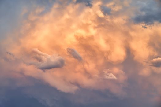 Captivating view of golden clouds illuminated by the setting sun.
