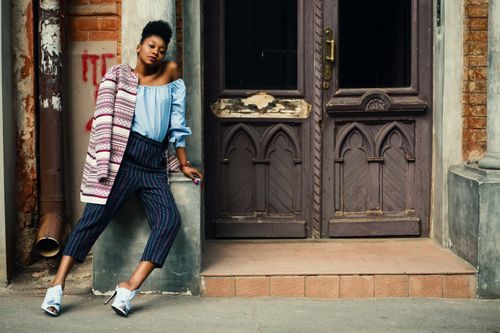 Free Stylish woman posing in front of vintage architecture in Kharkiv. Stock Photo